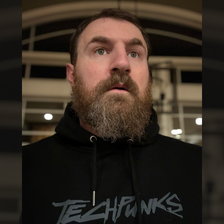 Kevin Whalen a.k.a. the bearded programmer wearing a TECHPUNKS Hoodie MAX.
